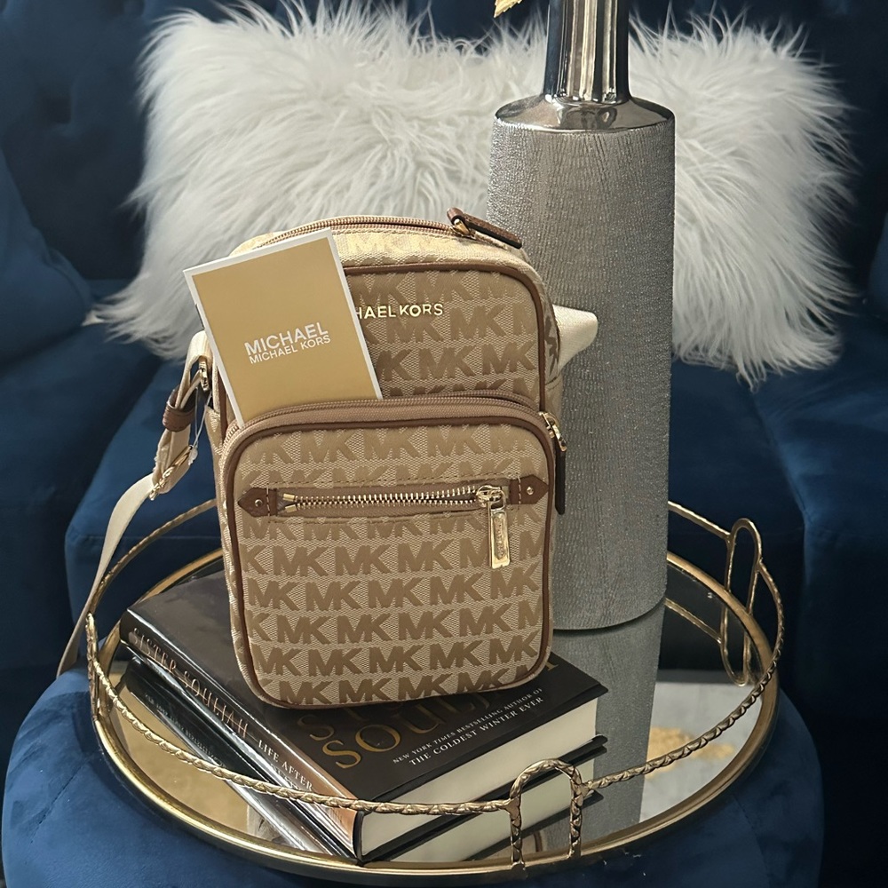 Brand new, never used Michael Kors camera crossbody. Medium size, tan- canvas